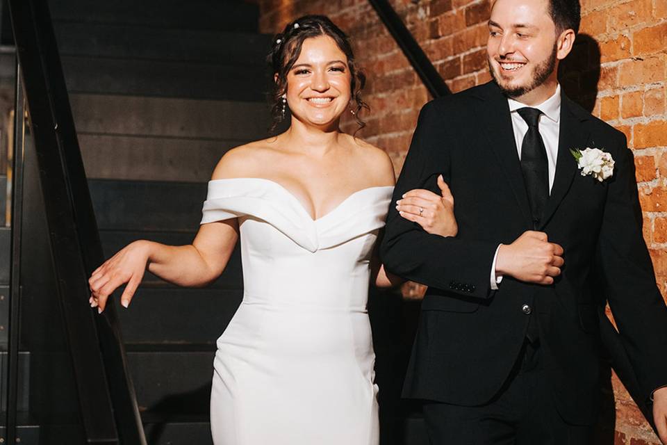 Bride & Groom walk down stairs