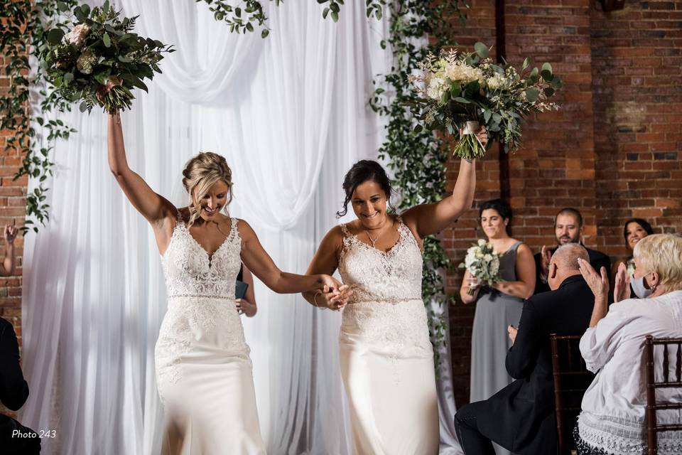 Brides cheer holding hands