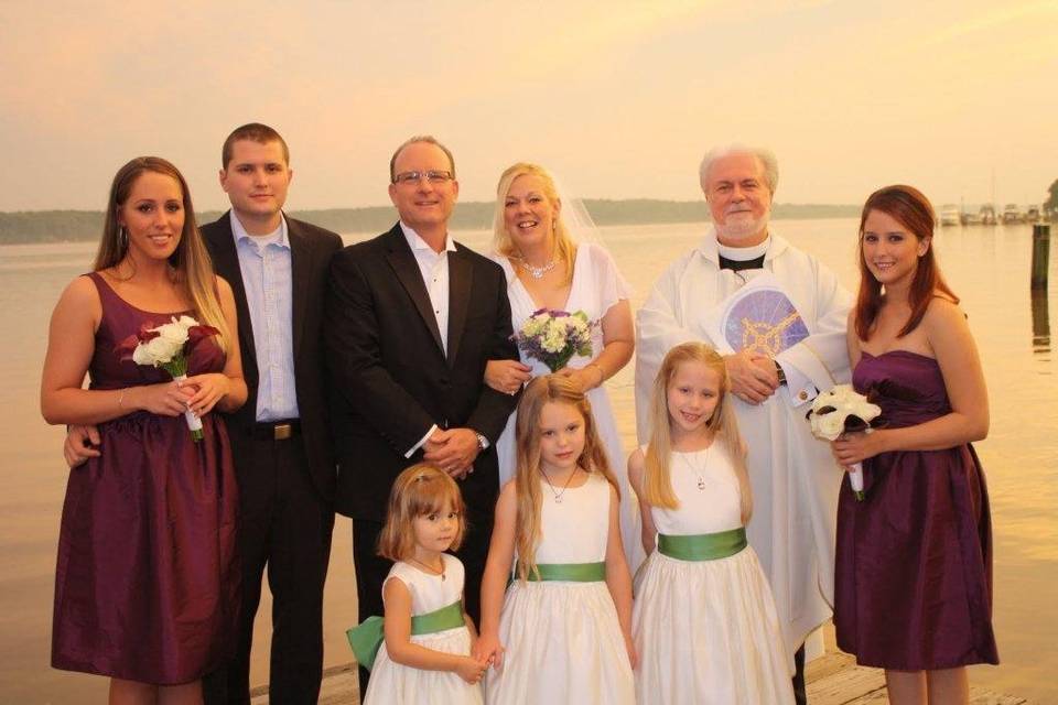 Wedding attendants with the officiant