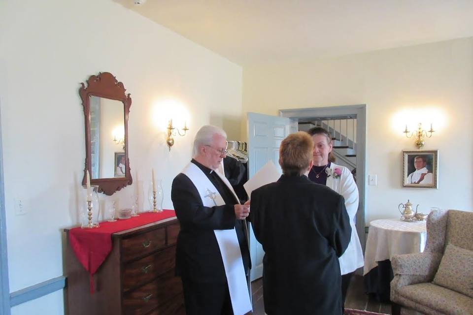 The flower girl with the wedding officiant