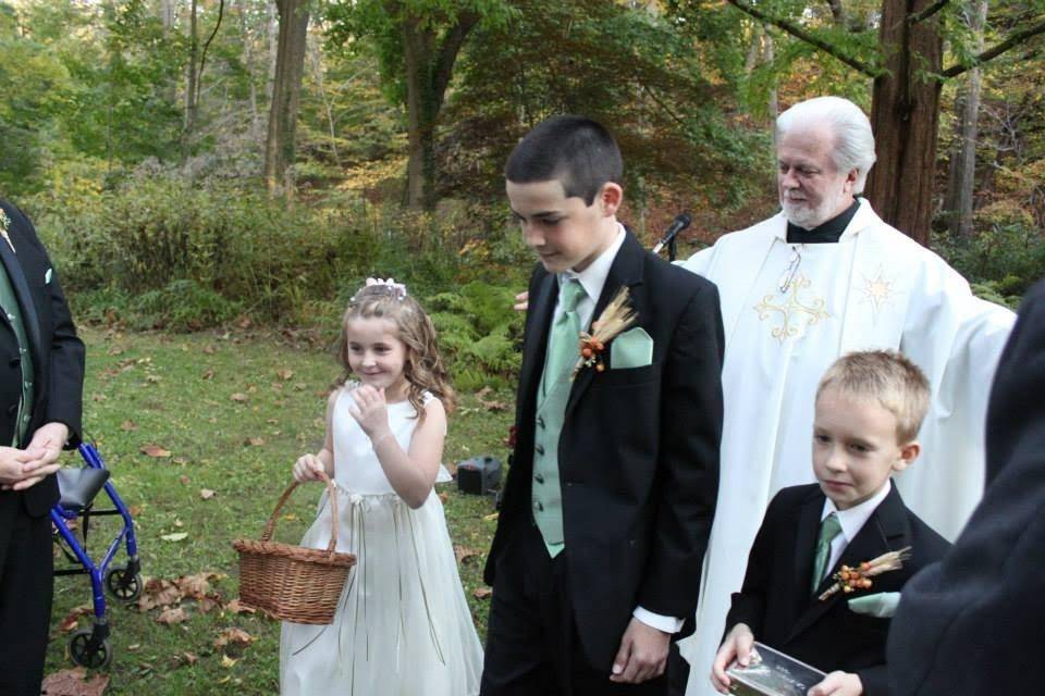 Wedding attendants with the officiant