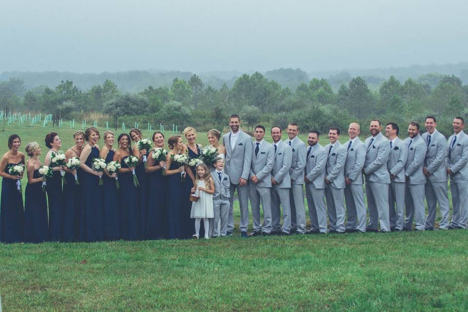 The couple with the bridesmaids and groomsmen