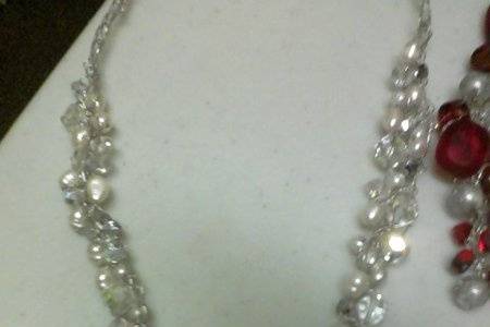 WOVEN FRESH WATER PEARLS WITH SILVER TONE WIRE, SWAROVSKI CRYSTALS WITH A DROP ALSO CONSISTING OF PEARLS AND CRYSTALS.