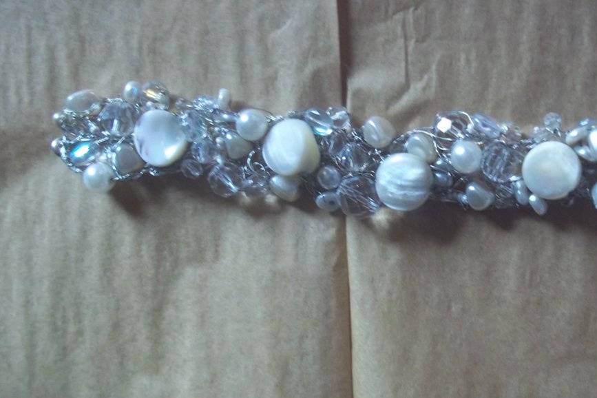 This braclet can be made with gold, silver or even black wire. It also can be made 2 rows wide or three rows, smaller pearls or which ever you like! also has a strong magnetic clasp,or which ever you desire.