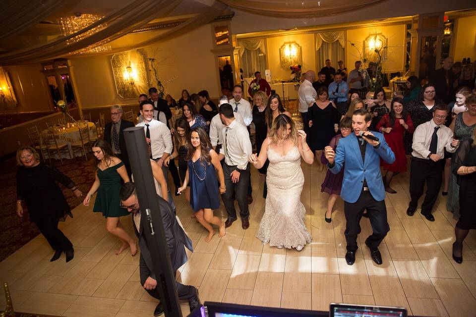 Dancing newlyweds with guests
