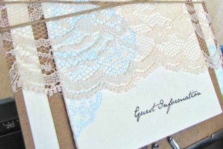 {Vintage Inspired} Wedding Invitation Suite
*Two-layer, Handmade Invitation
*RSVP Postcard
*Guest Information Booklet
*Lace + Twine Wrap
*Envelope with Kraft wrap-around label
http://www.etsy.com/listing/80195490/new-vintage-inspired-customizable