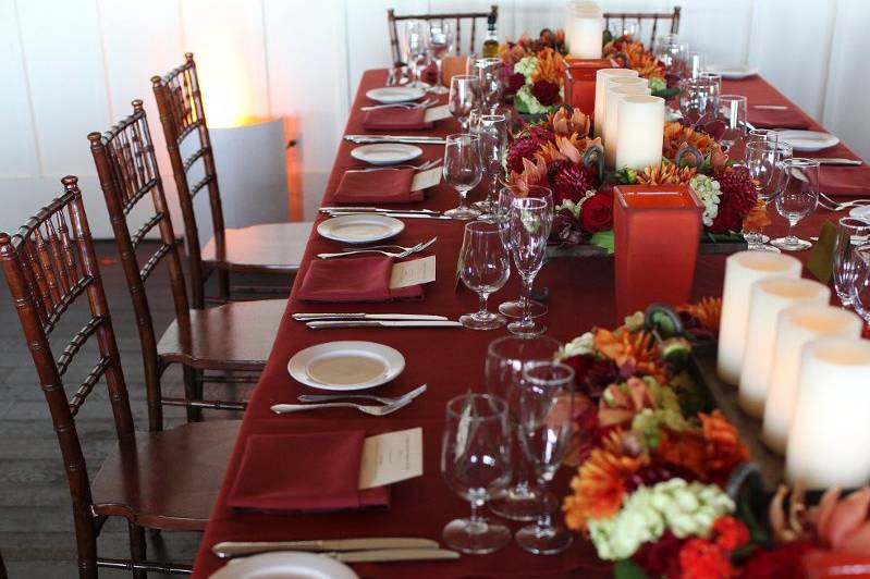 Table setup with candle and floral centerpiece