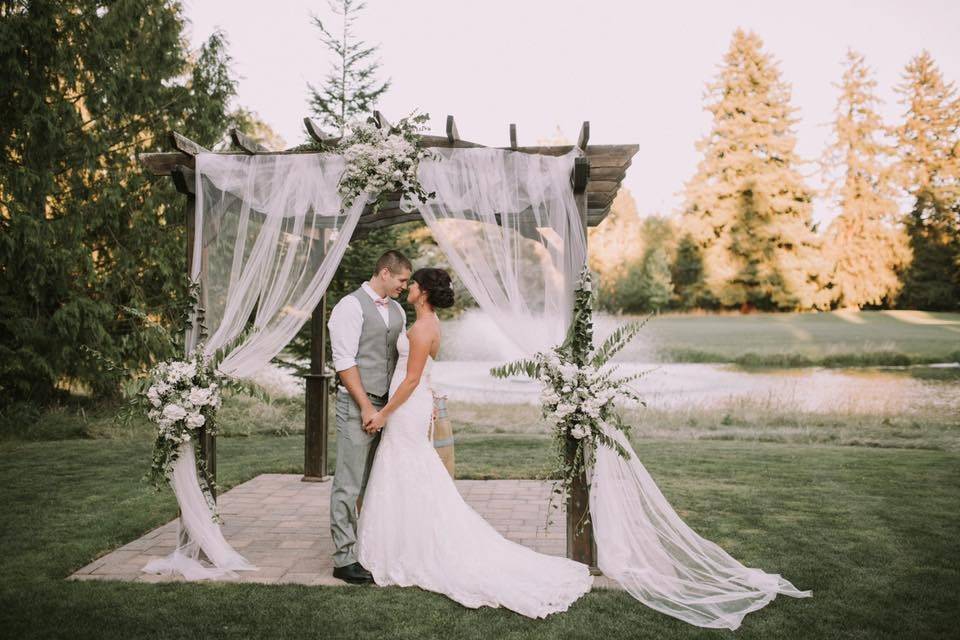 Couple in a wedding arbor