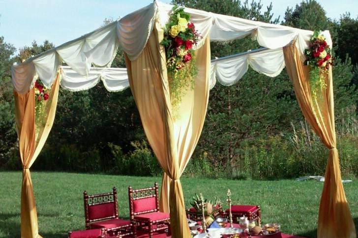 Gold, Red, & Ivory Mandap. Mandap furniture rental also available with red carpet.