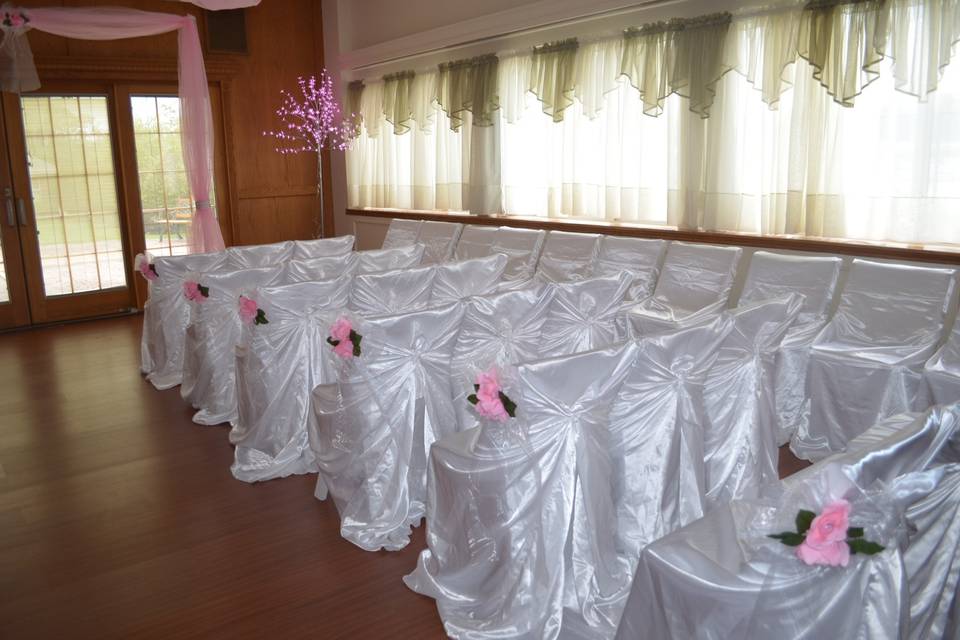 Black Satin Chair Cover with Pink Satin Sash and a rhinestone