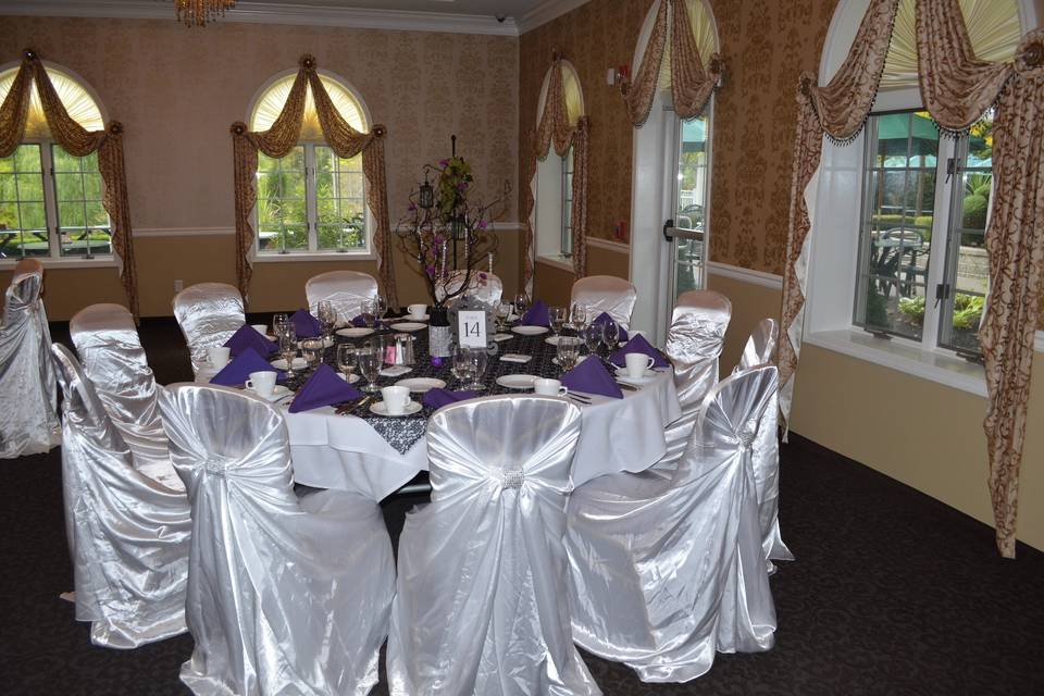 White Chair Covers with Red and Royal Blue Sashes. Buffalo Bills Themed Event