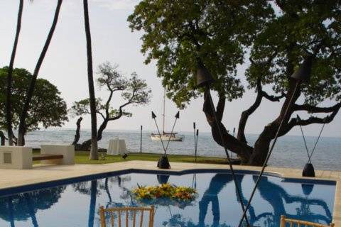 Dinner on the travertine pool deck, just a few feet away from the ocean.