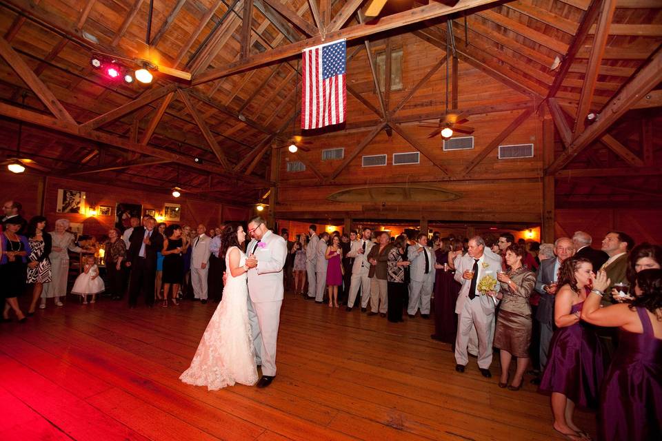 Reception in our Performance Center with cypress floors and raised stage