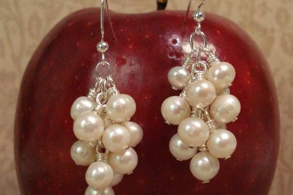 Beautifully shaped freshwater pearls clustered together to make these earrings. They are the epitome of class and elegance, perfect for a wedding, a dinner party, or a night on the town!
* 5mm & 7mm freshwater pearls
* Sterling Silver hand crafted ear hooks
* Hand crafted in Nashville (with Love)
www.etsy.com/shop/jomariejewelry