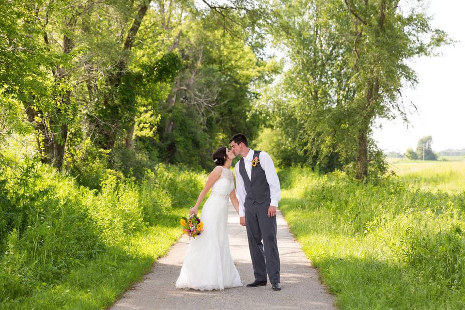 Kissing and holding hands - Midwest LifeShots Photography