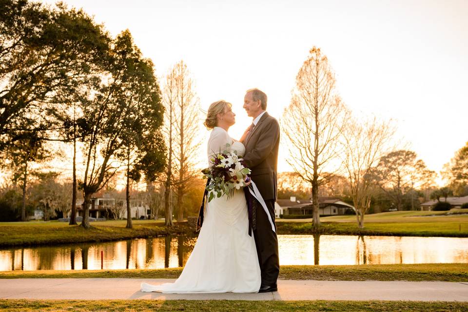Beautiful bride and groom, in the sunset light, after saying their 