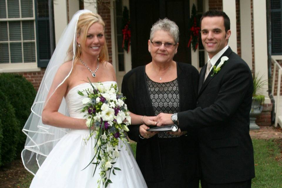 Officiant with newlyweds