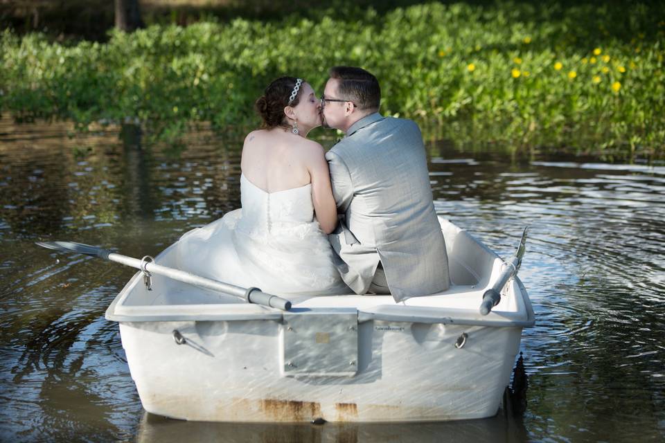 Bride and groom in a row boat