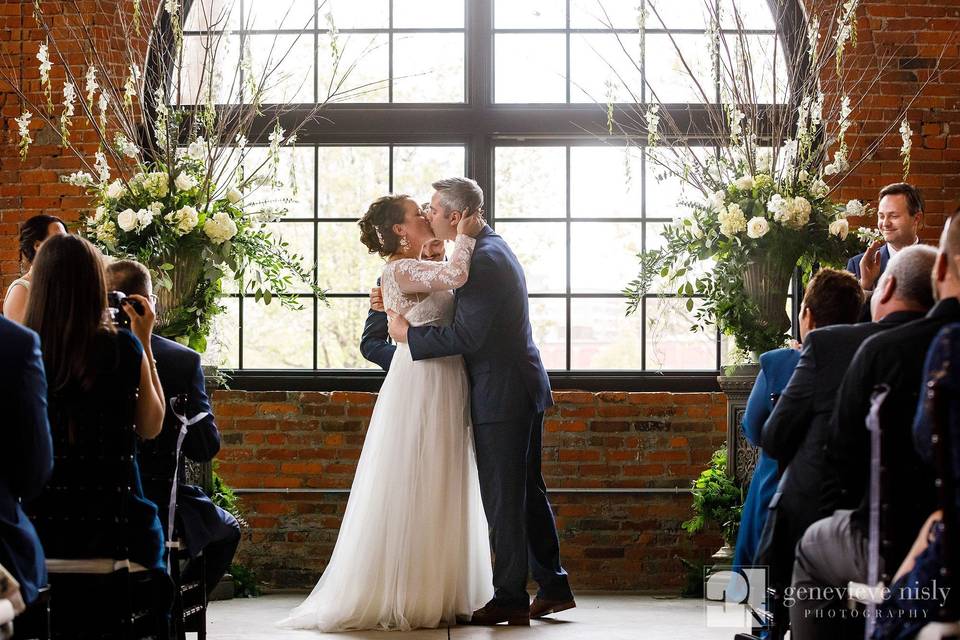 Man & Wife in front of Windows