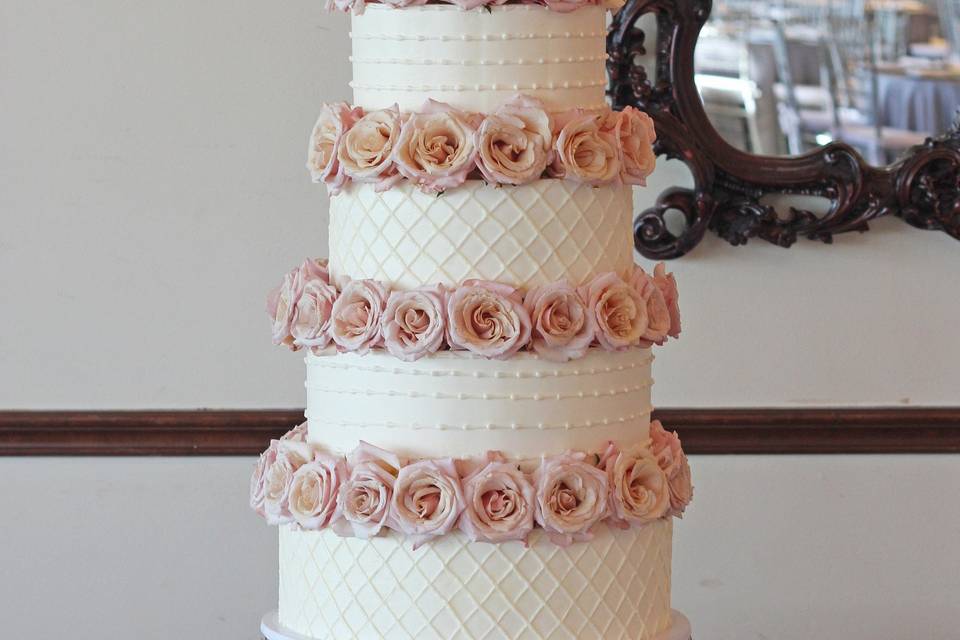 6 tiers of Swiss meringue buttercream with fresh roses
