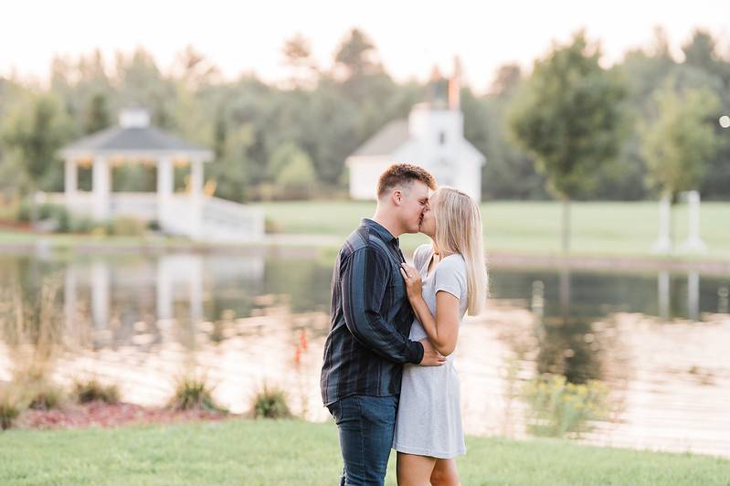 Engaged couple by lake