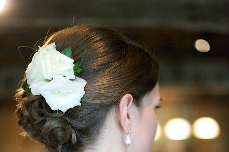 Neat pulled back bun with flower