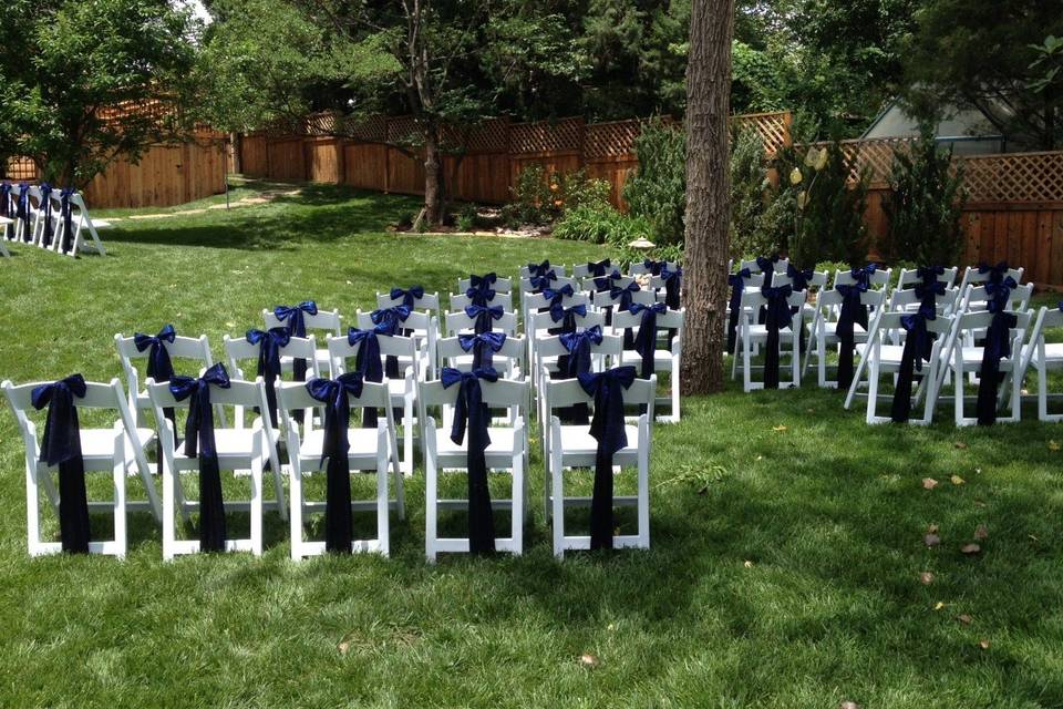 White resin chairs + chair tie