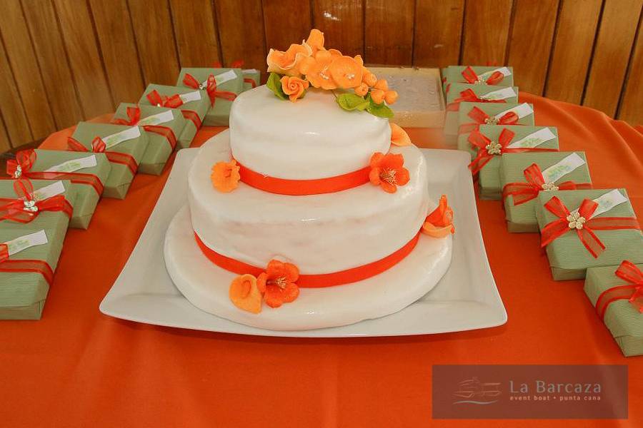 Simple white wedding cake with orange flowers