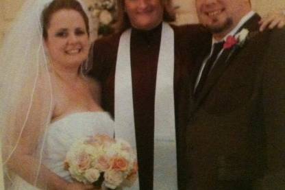 The officiant with the couple