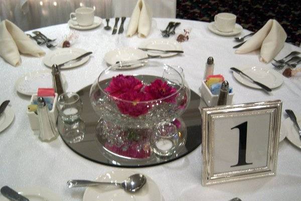 Mirrors, votives, numbers frames, and place settings all come courtesy of the Holiday Inn Downtown.