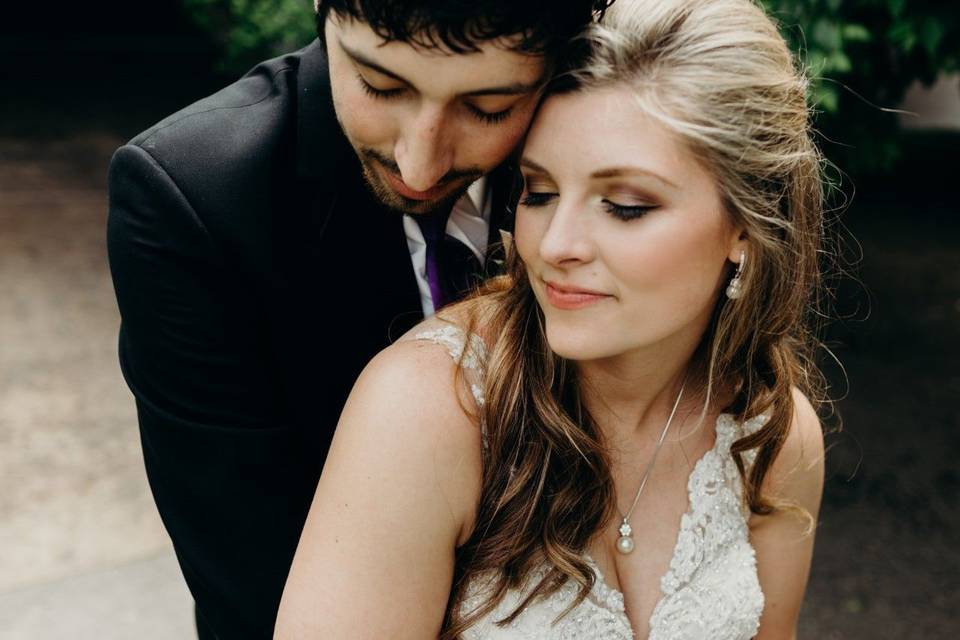 Groom hugging his bride