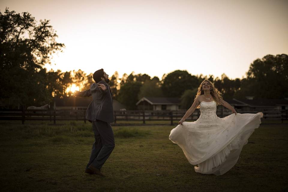 Newlyweds playing in the field