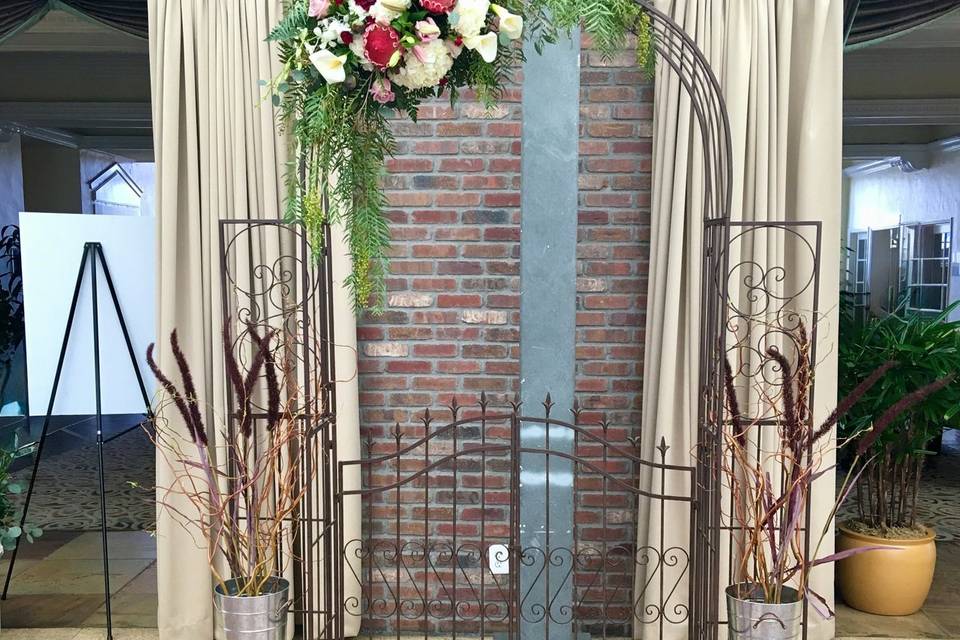 Indoor ceremony rustic arch