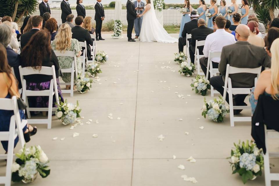 Outdoor ceremony aisle flowers