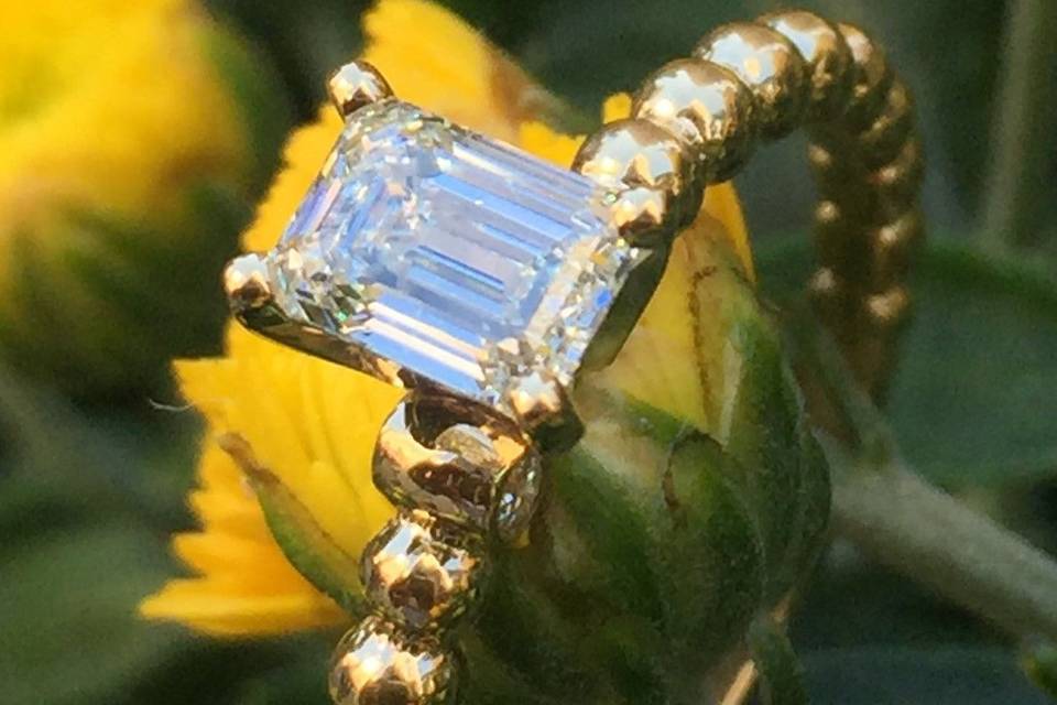 Emerald cut gold beads engagement ring