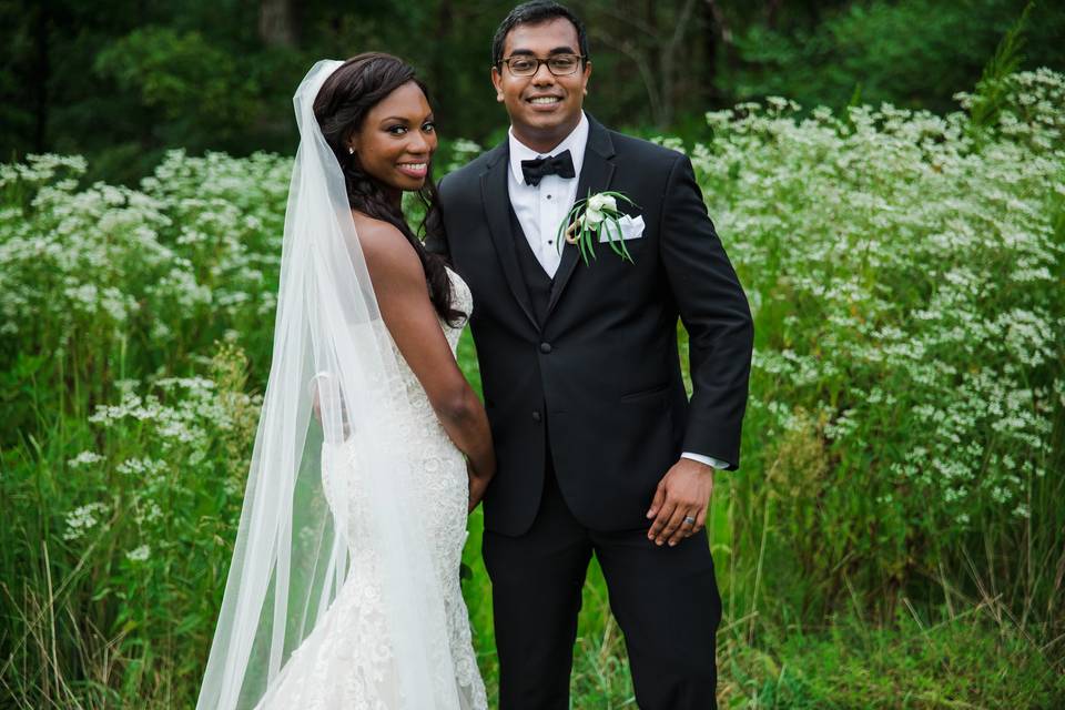 Newlyweds by the flowers