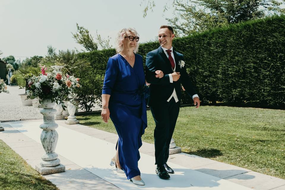 Groom and mother smiling