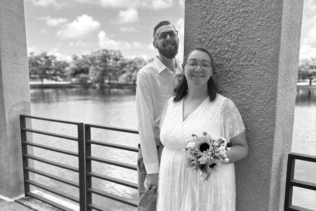 The couple by a waterfront pil