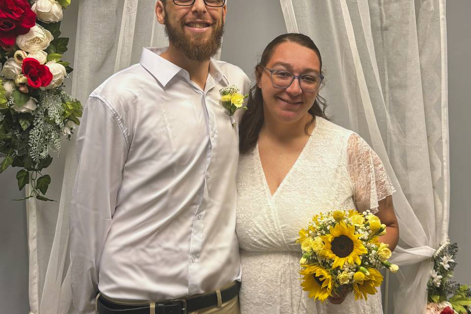 The couple smiling together at