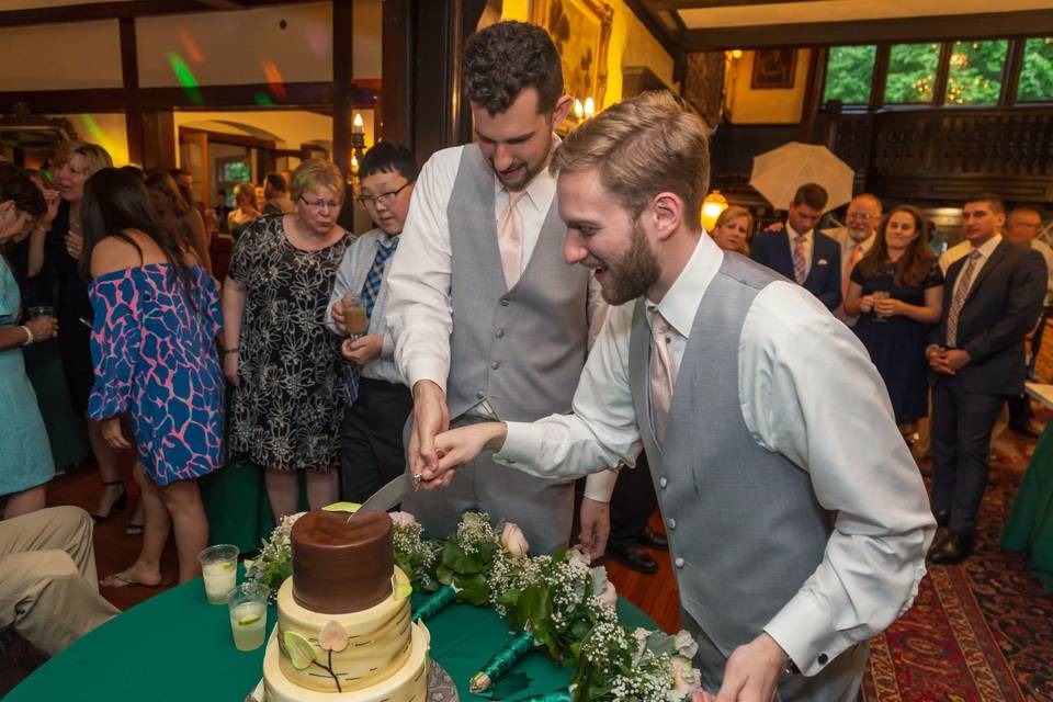 Couple cutting cake