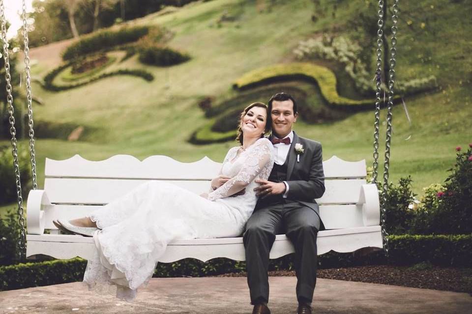 The newlyweds riding the swing