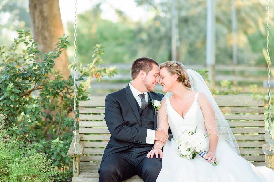 Groom and bride on the swing