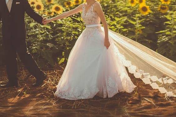 Bride and groom at a sunflower field