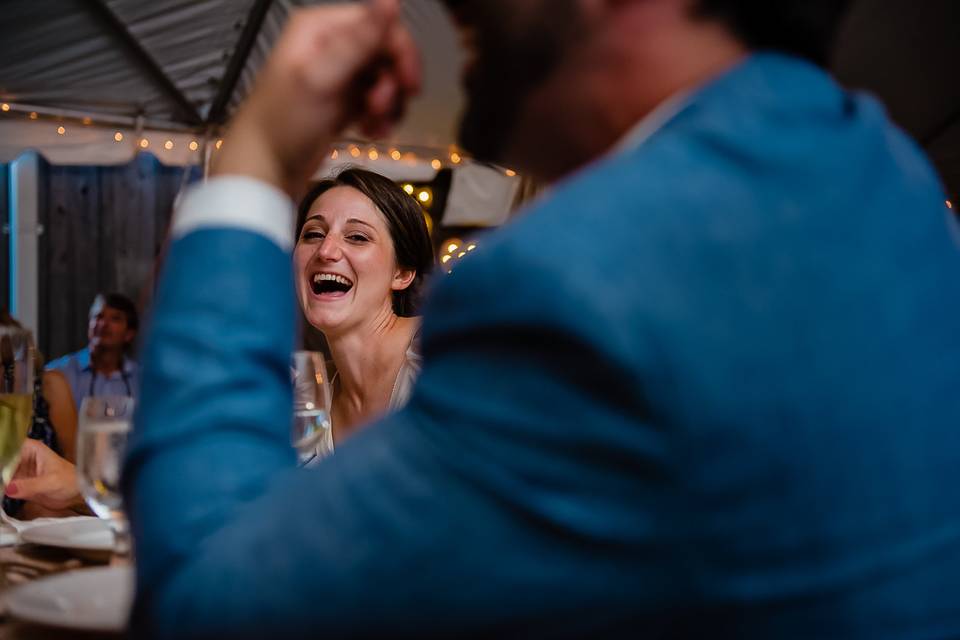 Bride laughing during speech