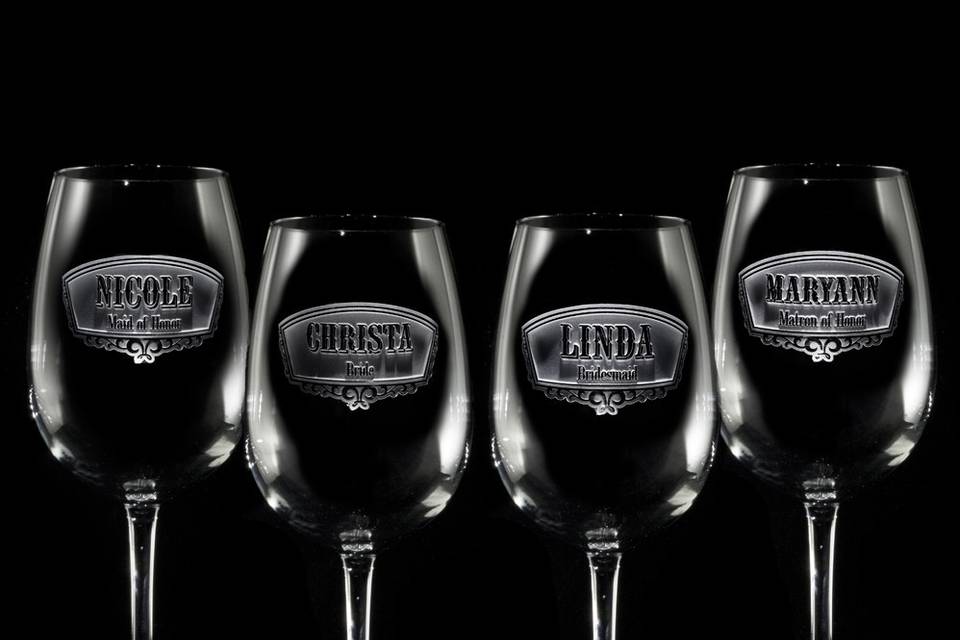 Bridesmaid gift ideas, groomsman gift ideas such as best man and maid of honor engraved wine glasses.