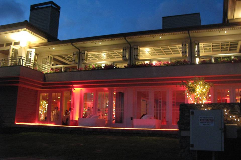 Outside view of the Plantation House Restaurant in Kapalua.  The pink uplights are outside of the 