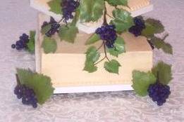 Perfect for the Vineyard wedding.  Square cake adorned with hand made sugar grapes, vines and leaves.