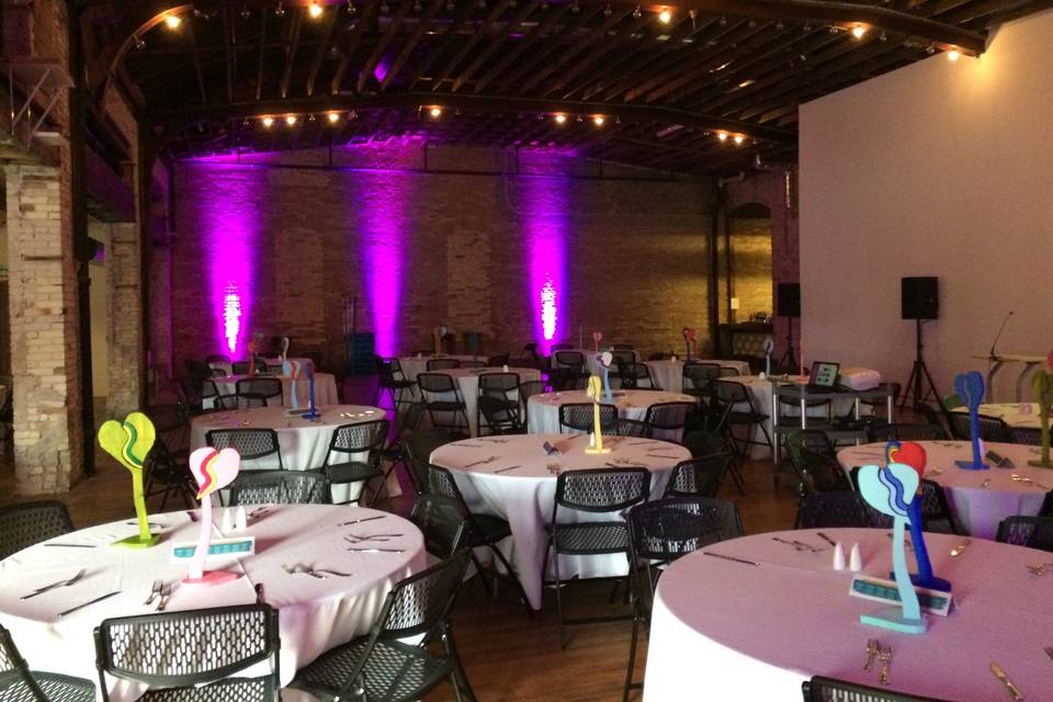 recent wedding set up at the Harris Building in Grand Rapids. Showcasing uplighting at venue.