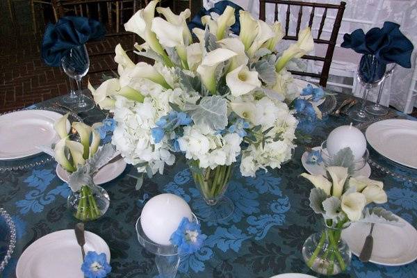 Crisp white and blue flowers enhance the blue linen.