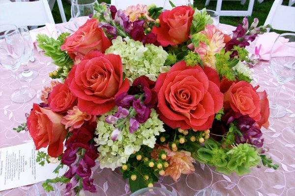 Lush garden flowers in this brightly colored centerpiece.